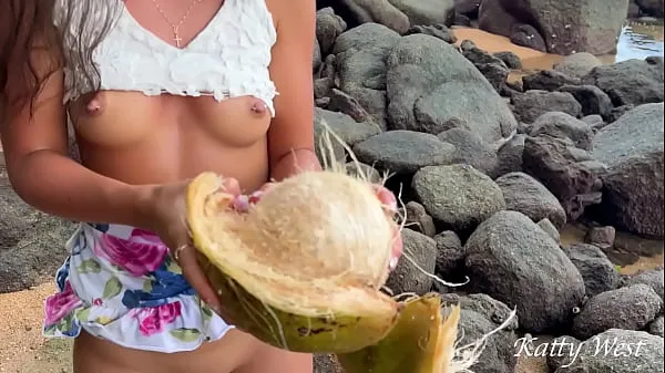 Show Naked girl found a coconut on a public beach and poured the juice over her body drive Videos